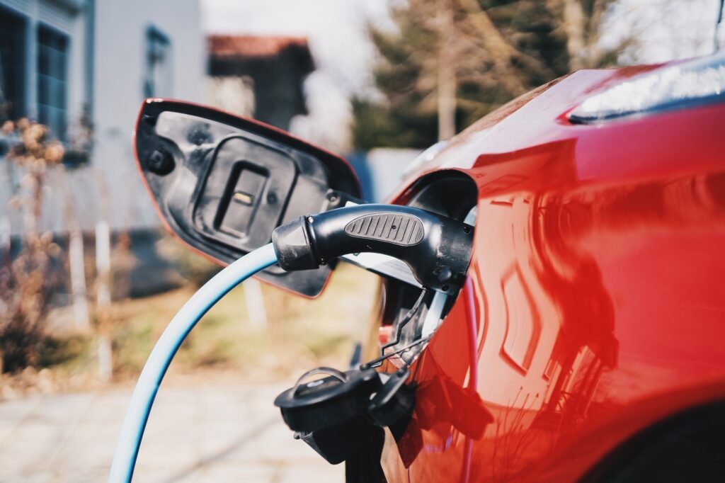 Charging electric car in the backyard