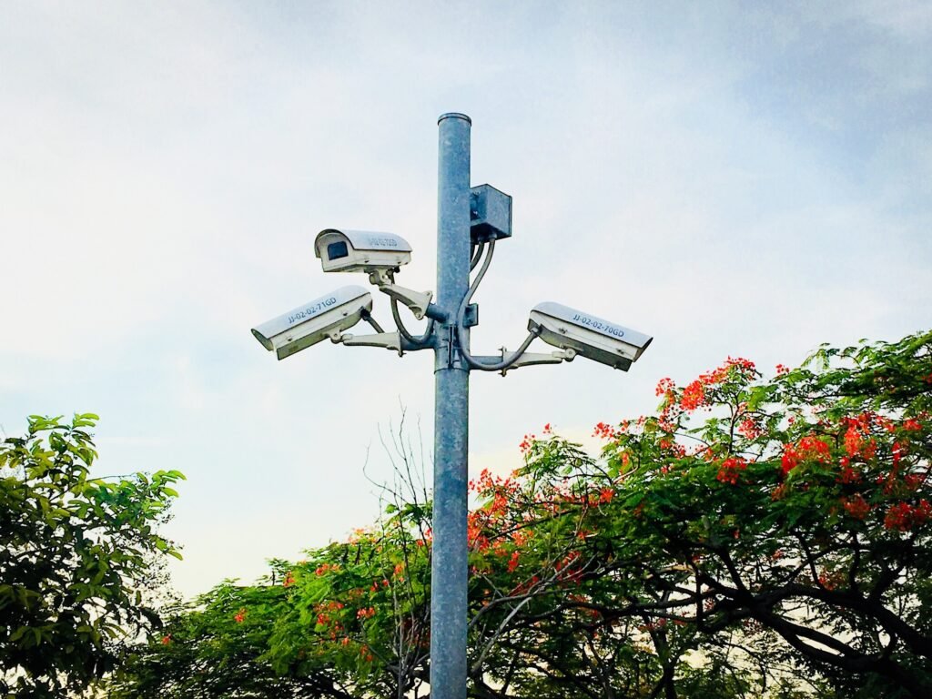 Security camera on the pole against sky